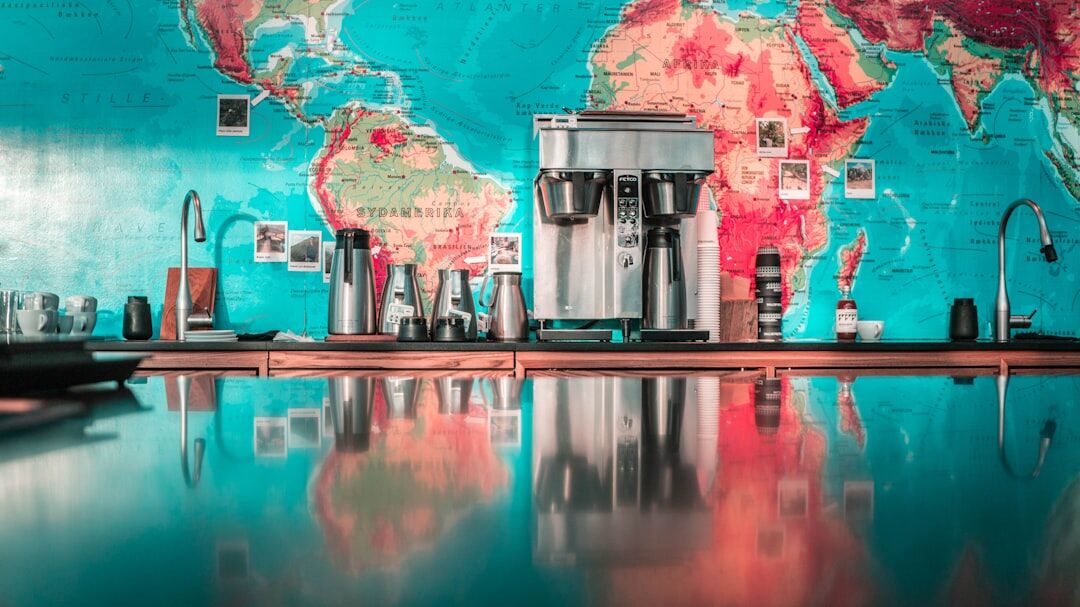 International business group meeting around a table with a world map