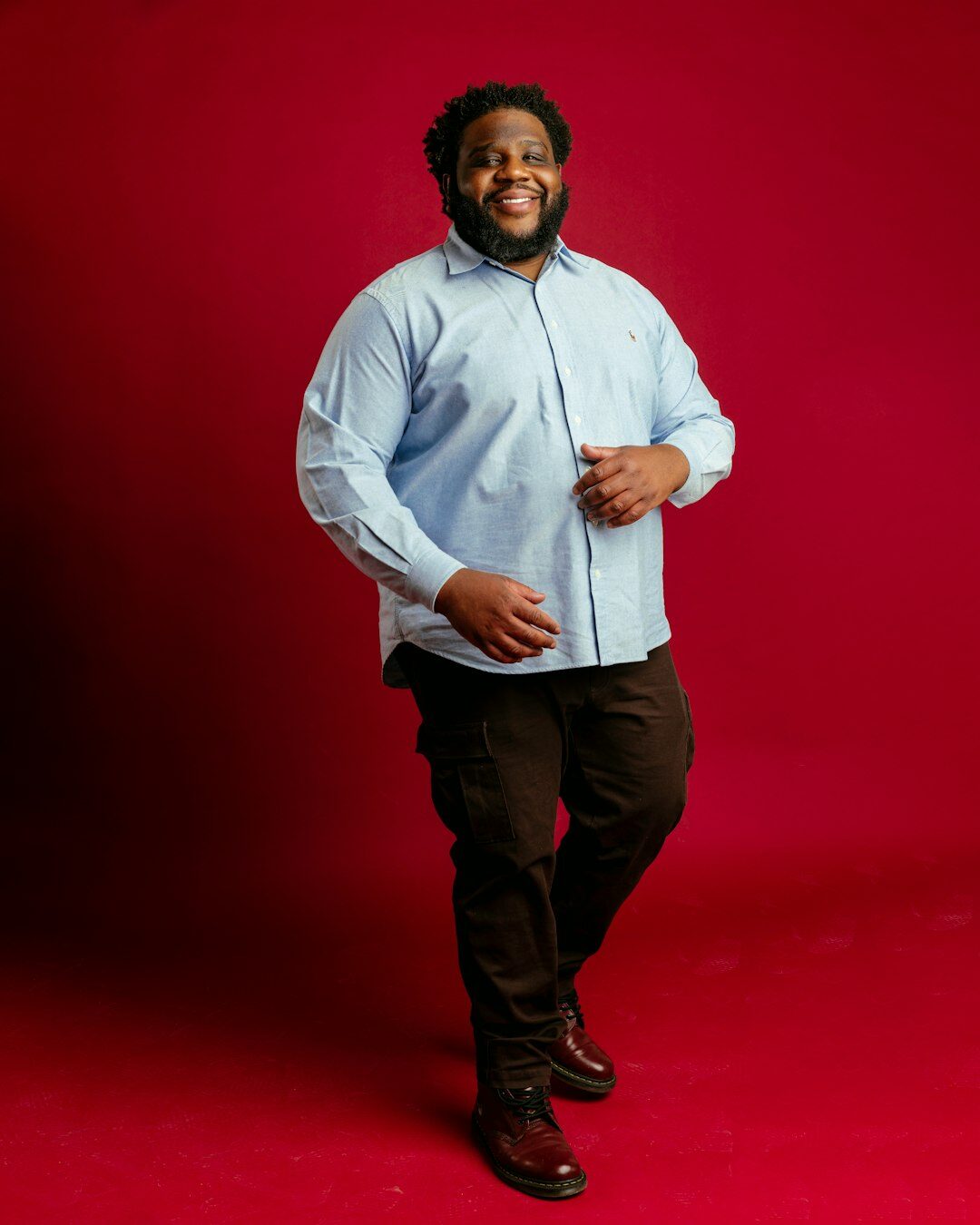 Studio portrait of a smiling businessman in a light shirt