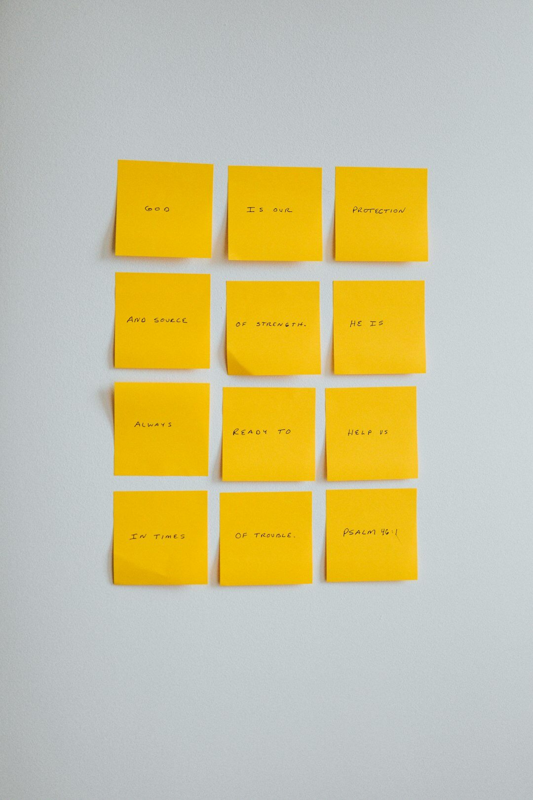 Team brainstorming marketing ideas with sticky notes on a glass wall